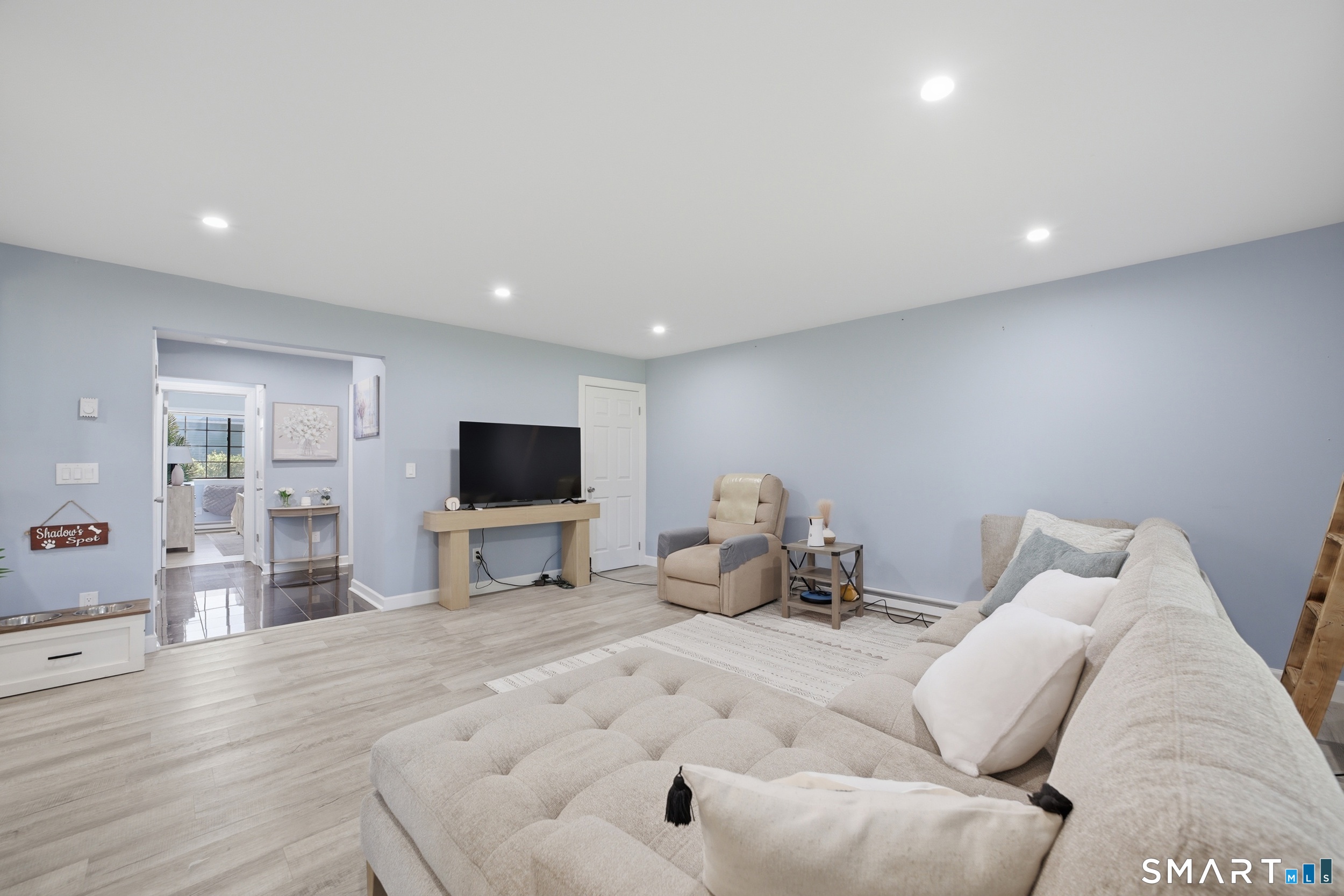 187 Flax Hill Road, Unit D1 Norwalk, CT 06854 - Photo 15 of 32 a living room with furniture and a flat screen tv