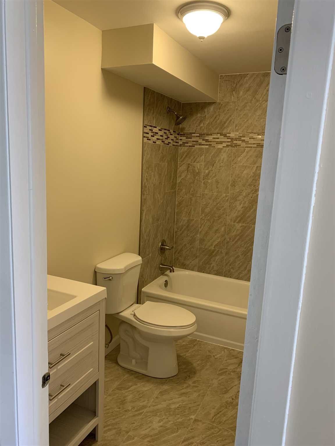10 White Gate Road, Unit J Wappingers Falls, NY 12590 - Photo 10 of 11 a bathroom with a toilet and a shower