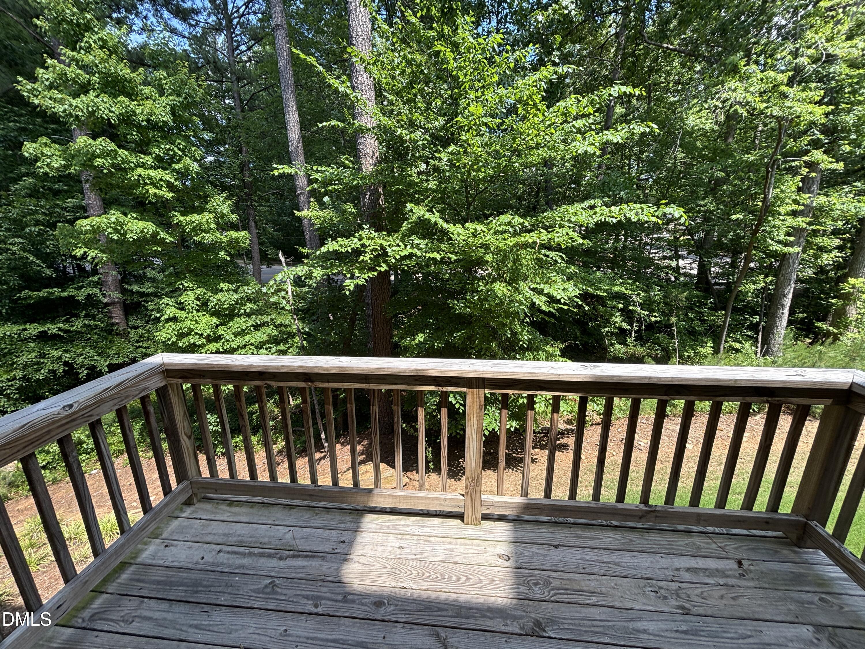 5710 Parker Pnes Court Raleigh, NC 27609 - Photo 32 of 78 a balcony with wooden floor