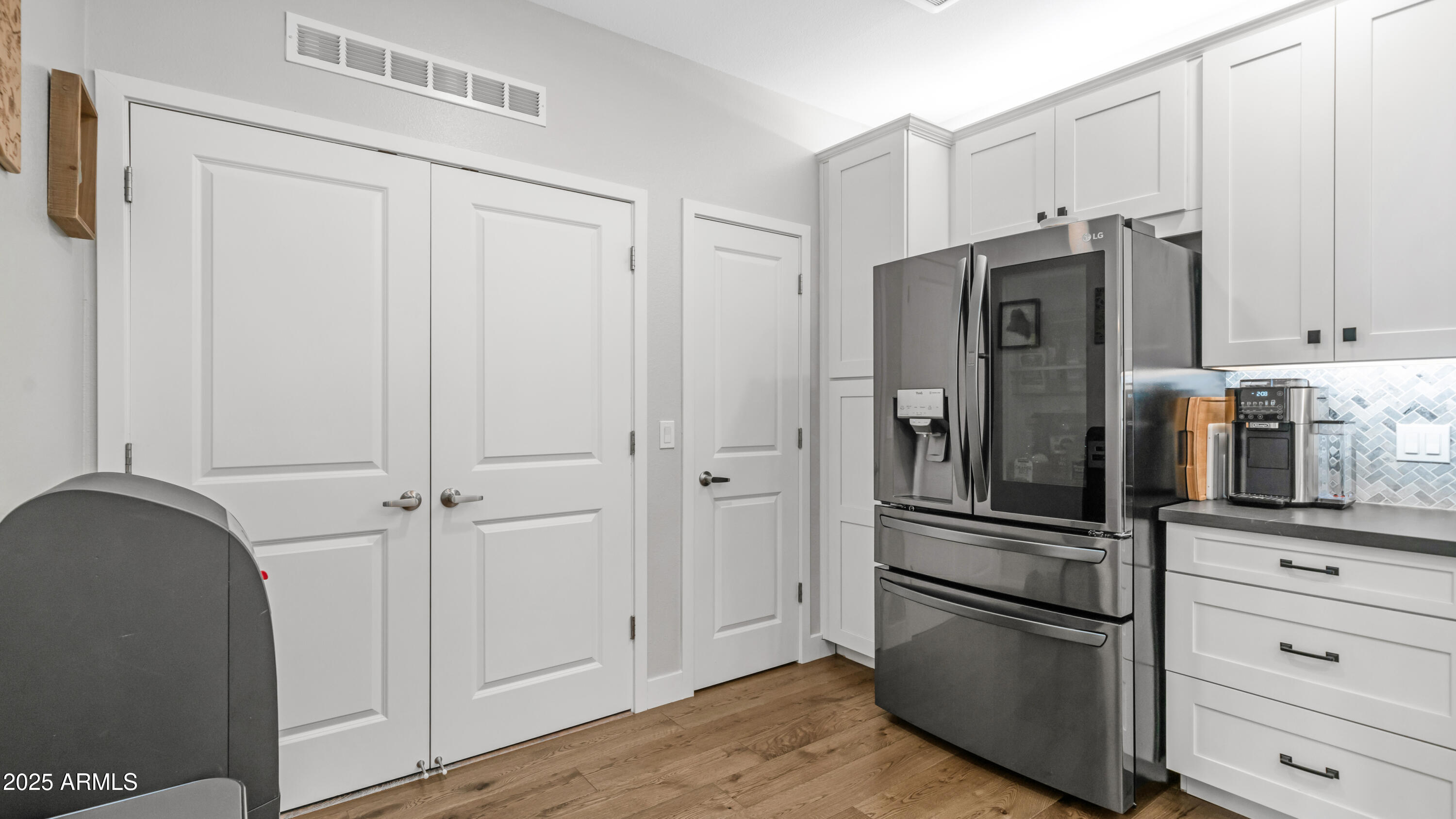 2511 West Queen Creek Road, Unit 166 Chandler, AZ 85248 - Photo 12 of 66 a kitchen with stainless steel appliances a refrigerator and cabinets