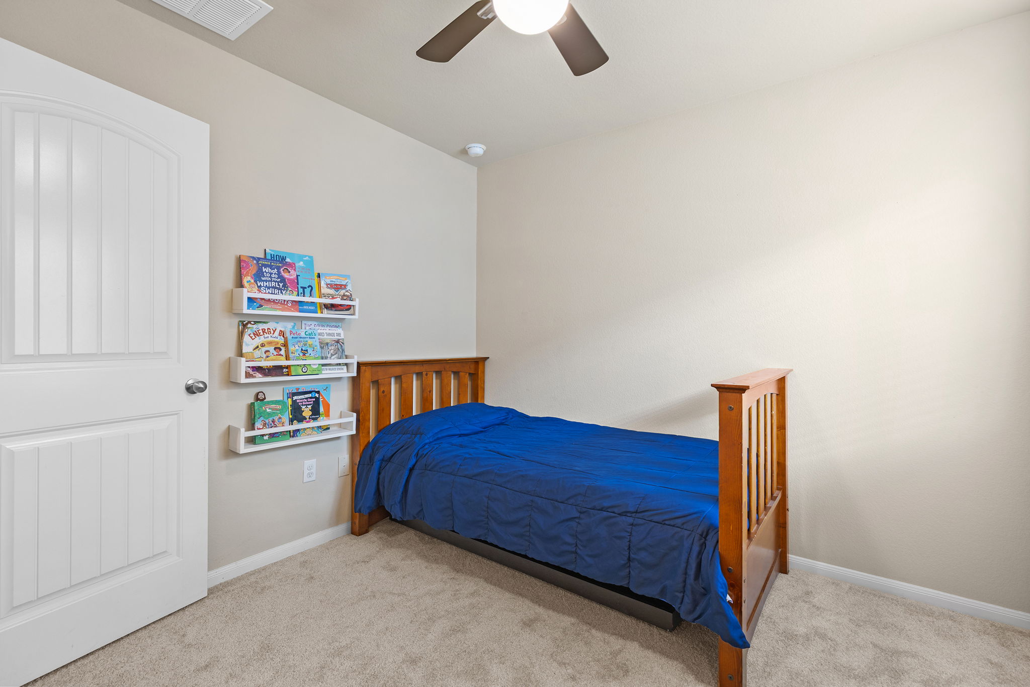 404 Cassandra Drive Hutto, TX 78634 - Photo 25 of 40 Bedroom featuring light carpet and ceiling fan