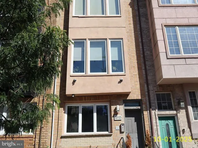 a view of a building with a window and brick walls