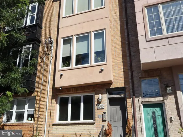 a view of a brick building with many windows