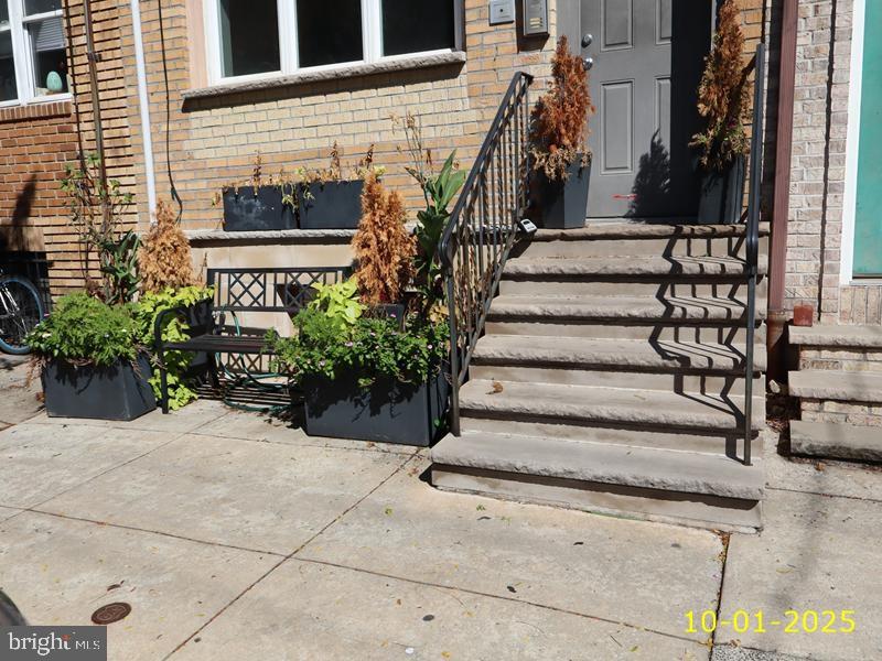 1815 Bainbridge Street, Unit 2 Philadelphia, PA 19146 - Photo 5 of 9 a view of a house with potted plants