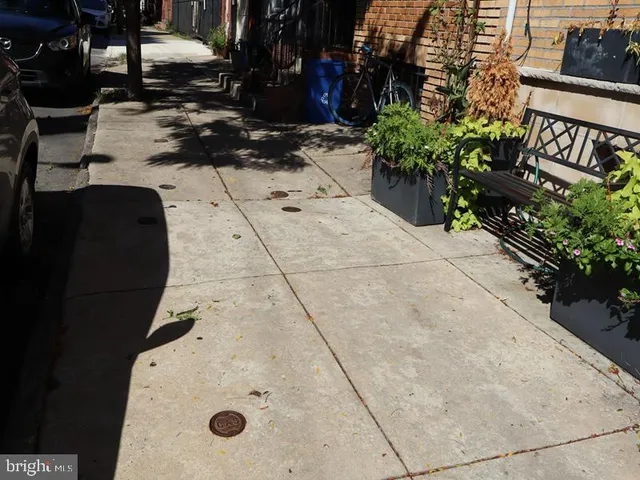 a view of a cars park in front of a house