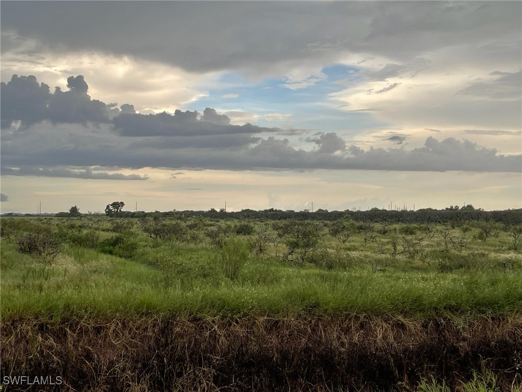 7112 6th Road Clewiston, FL 33440 - Photo 1 of 6 a view of a lake and mountain