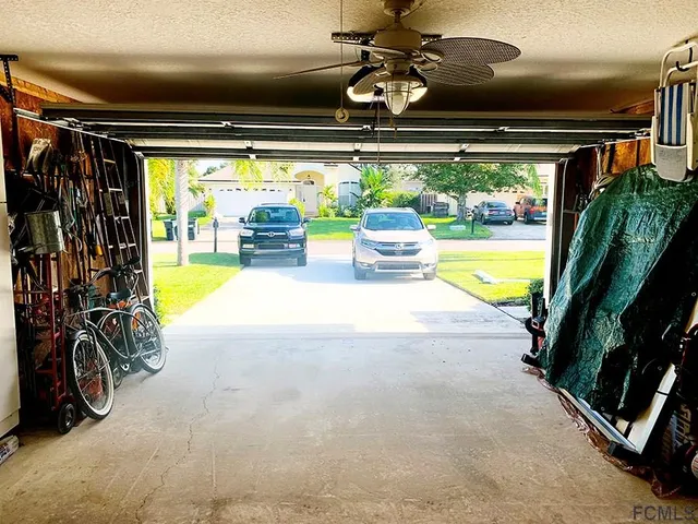 a view of a house with a yard and plants