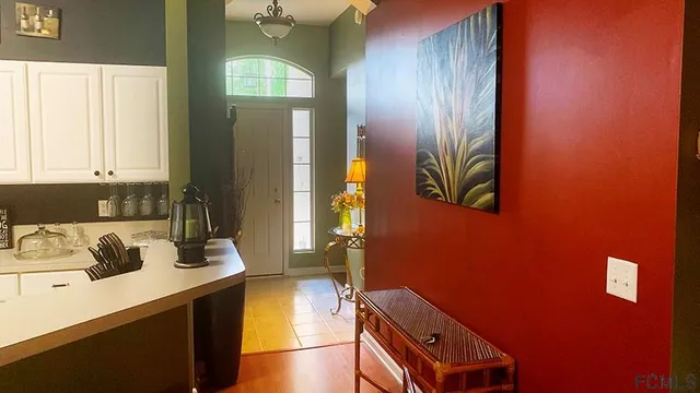 a kitchen with a refrigerator and a sink