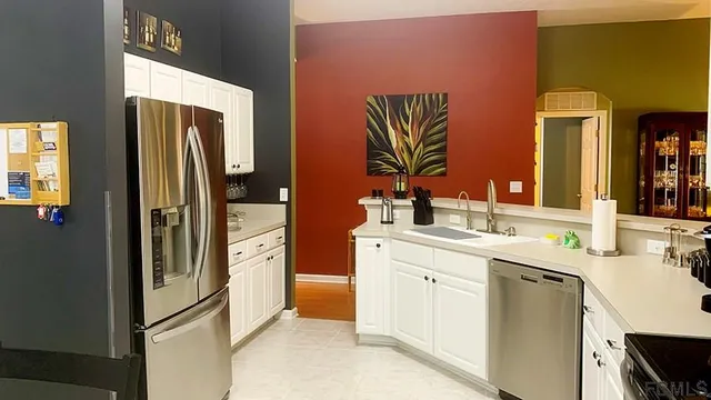 a kitchen with a sink stove and microwave