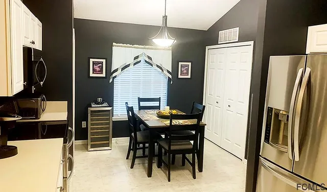 a living room with furniture a wooden floor and a chandelier