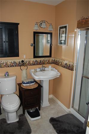 33 Madden Road West Brookfield, MA 01585 - Photo 11 of 21 a bathroom with a sink a toilet and mirror