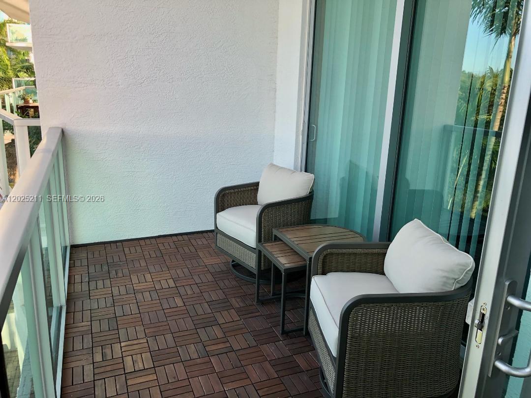 2681 North Flamingo Road, Unit 303S Sunrise, FL 33323 - Photo 15 of 18 a living room with furniture and a chair