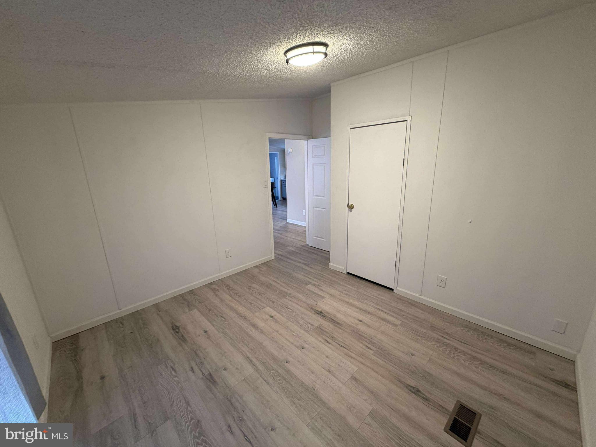 227 Forest Green Road Aberdeen, MD 21001 - Photo 14 of 22 a view of an empty room with wooden floor