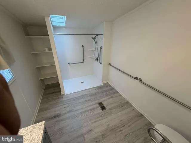 a bathroom with a shower and a shower