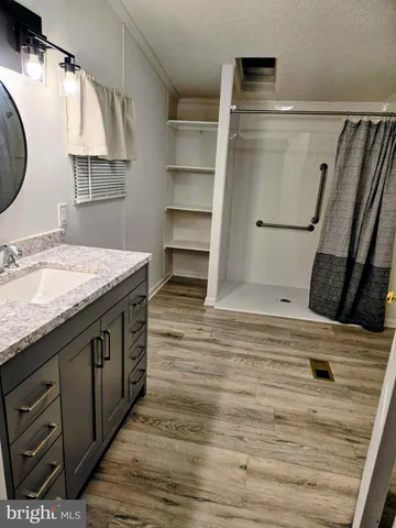 a kitchen with a refrigerator and a sink
