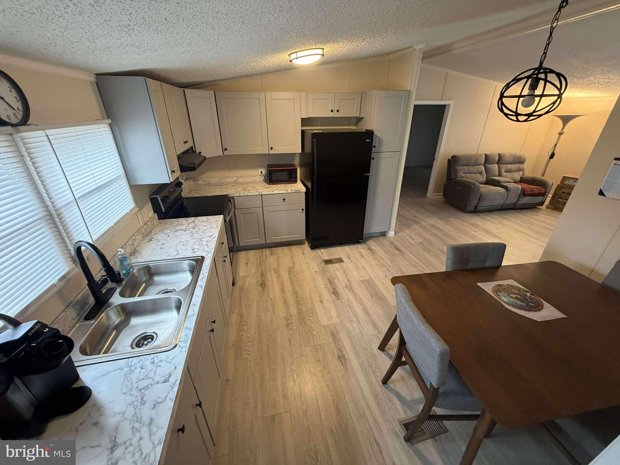 227 Forest Green Road Aberdeen, MD 21001 - Photo 7 of 22 a view of kitchen with furniture and wooden floor