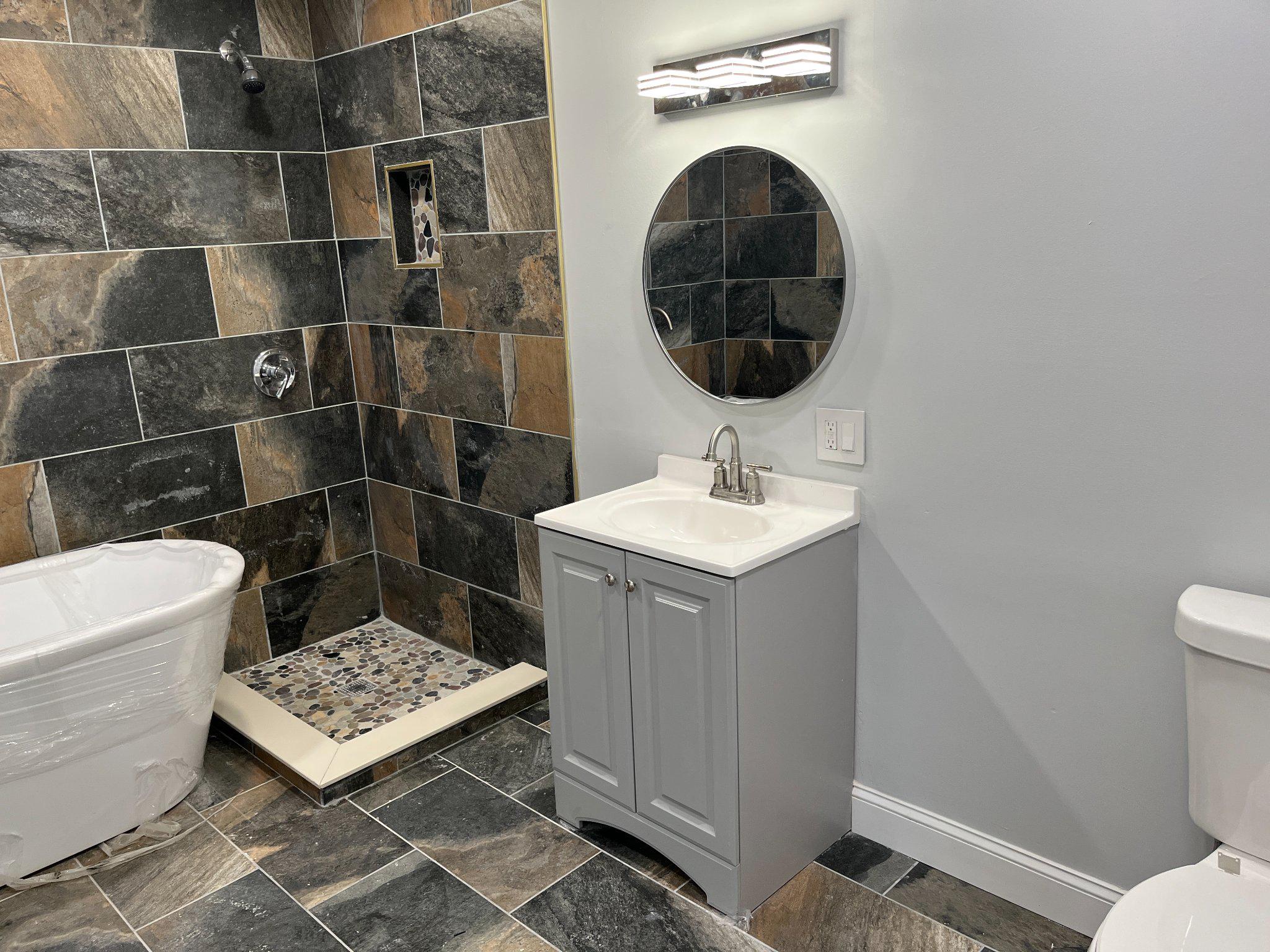 2405 Limestone Road Wilmington, DE 19808 - Photo 30 of 40 a bathroom with a sink toilet and shower