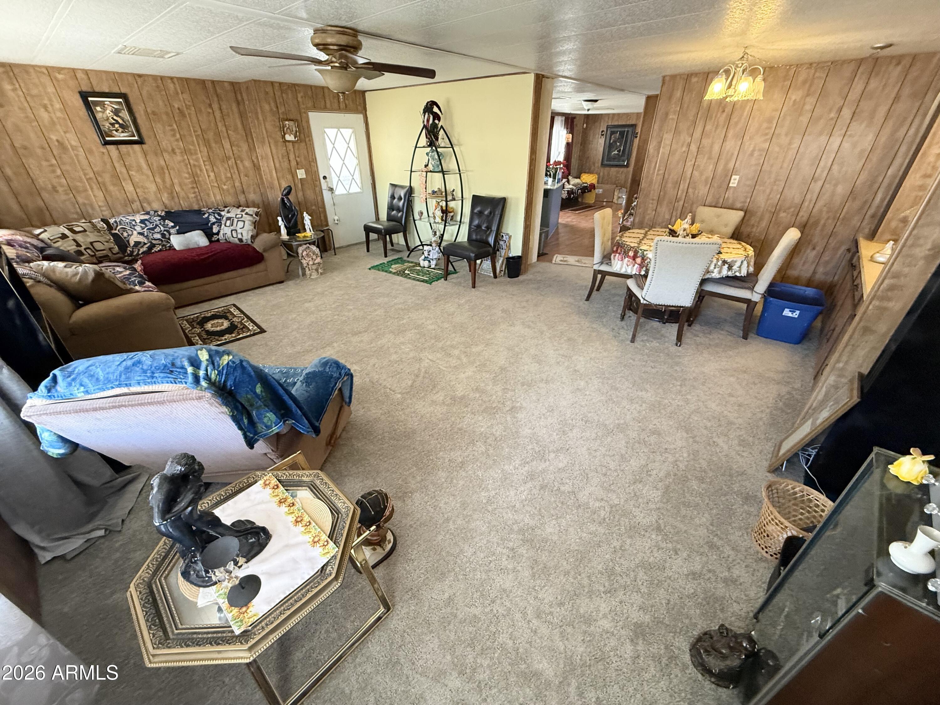 9501 East Broadway Road, Unit 252 Mesa, AZ 85208 - Photo 11 of 31 a living room with furniture and a window