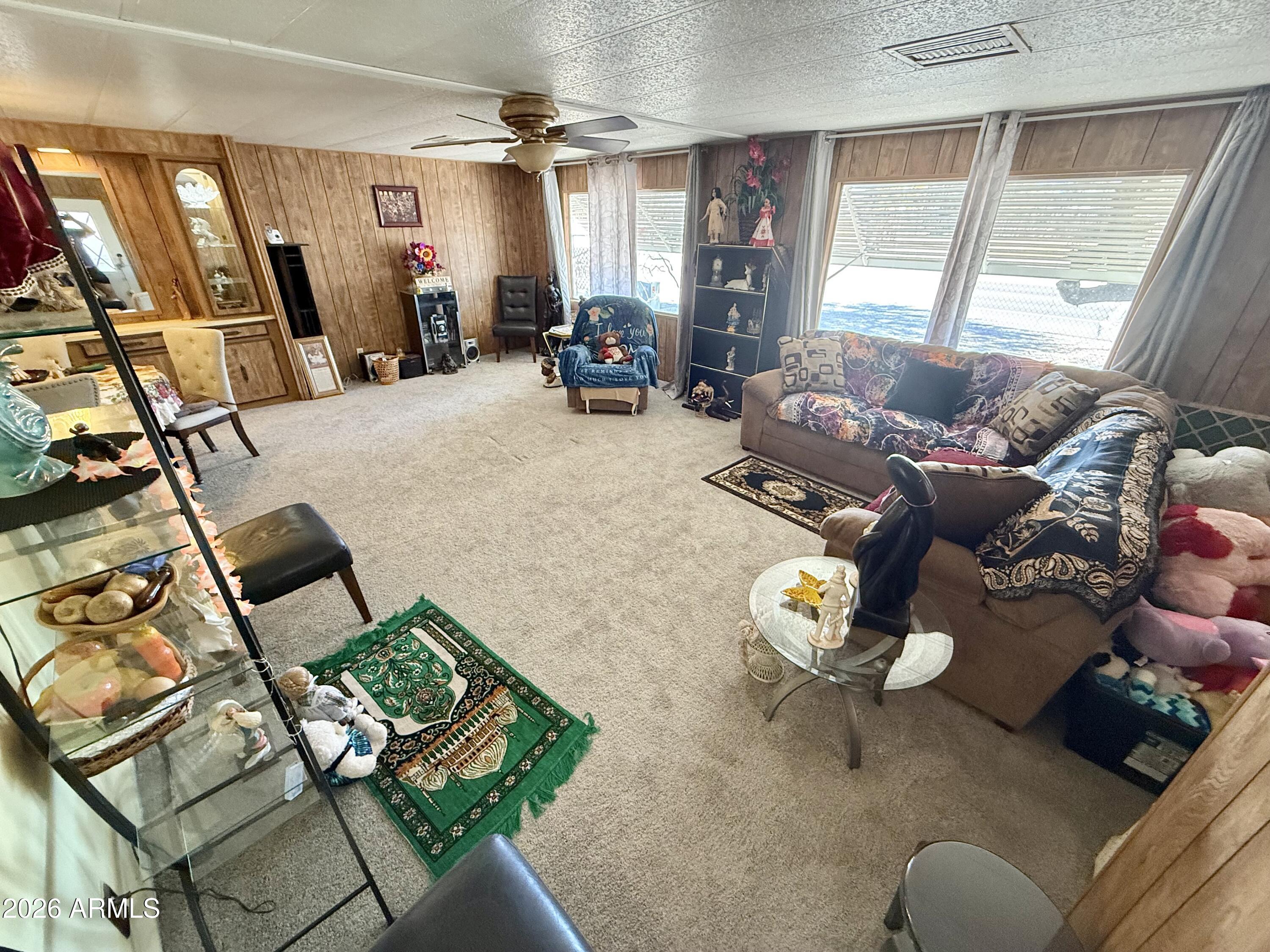 9501 East Broadway Road, Unit 252 Mesa, AZ 85208 - Photo 3 of 31 a living room with furniture and a window
