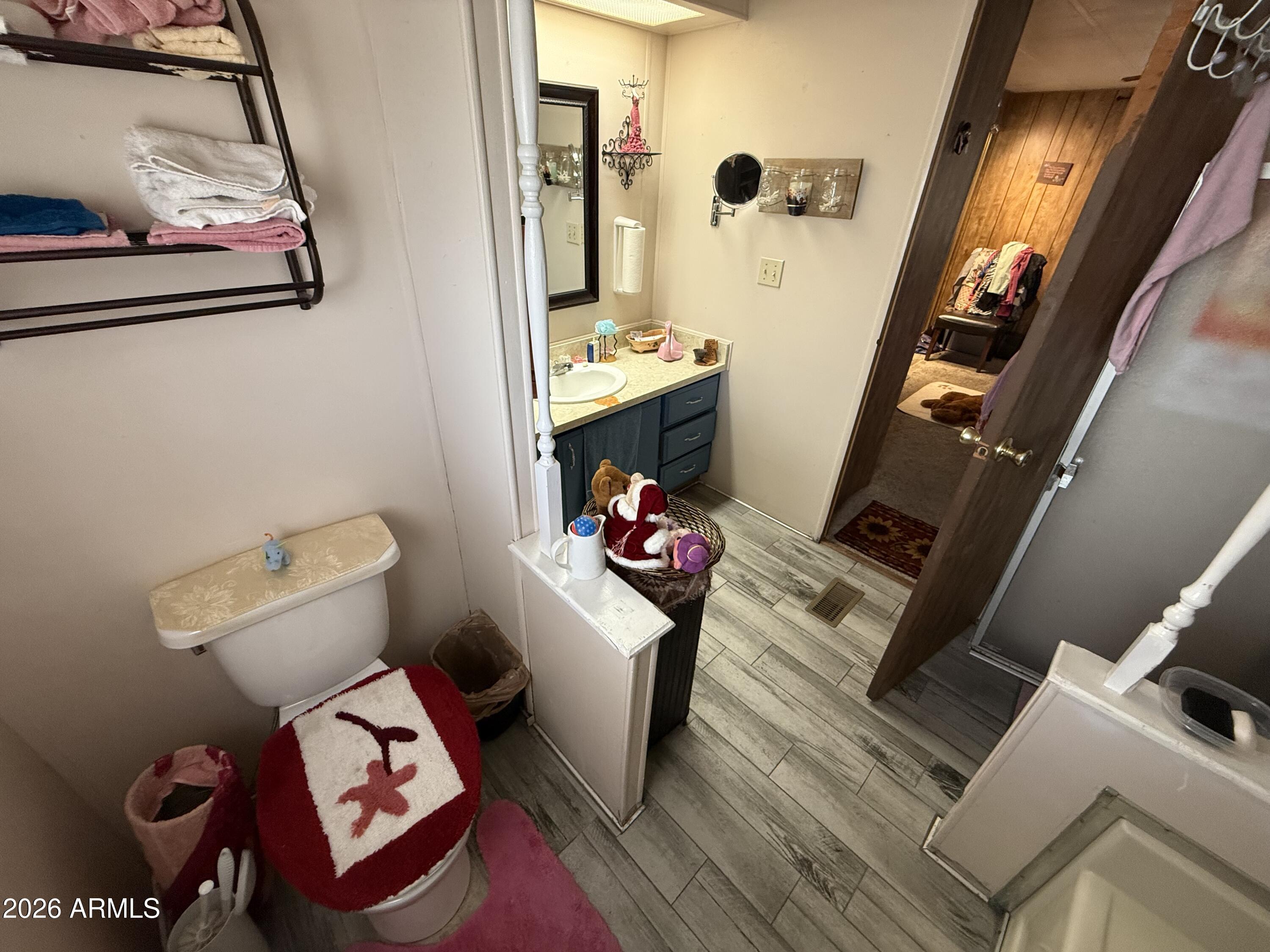 9501 East Broadway Road, Unit 252 Mesa, AZ 85208 - Photo 31 of 31 a room with furniture and a wooden floor