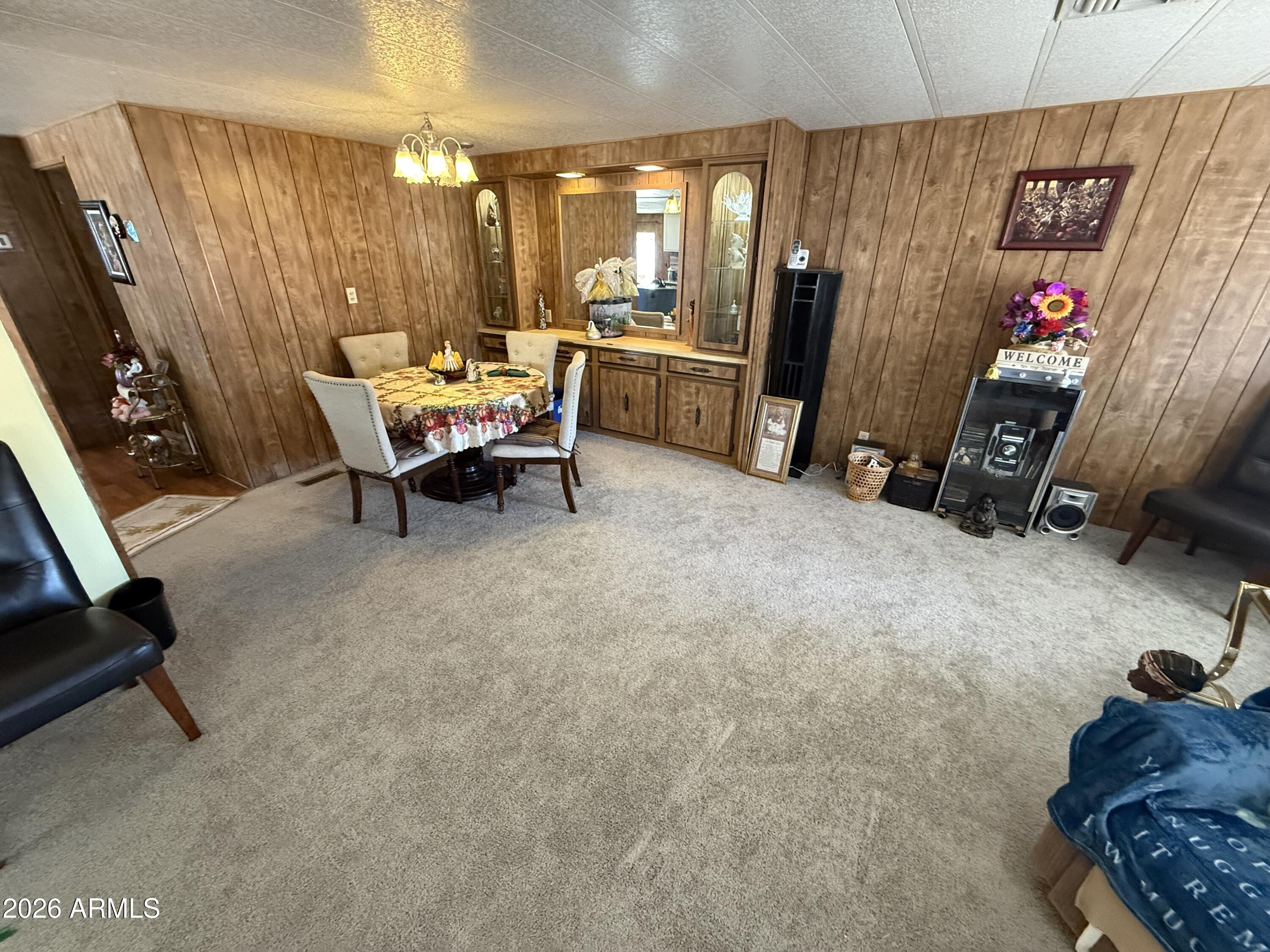9501 East Broadway Road, Unit 252 Mesa, AZ 85208 - Photo 4 of 31 a living room with furniture a window and gym equipment