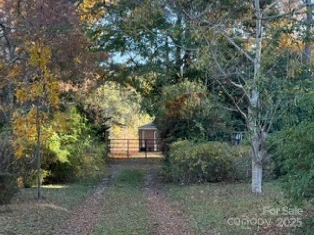 a view of a house with a tree