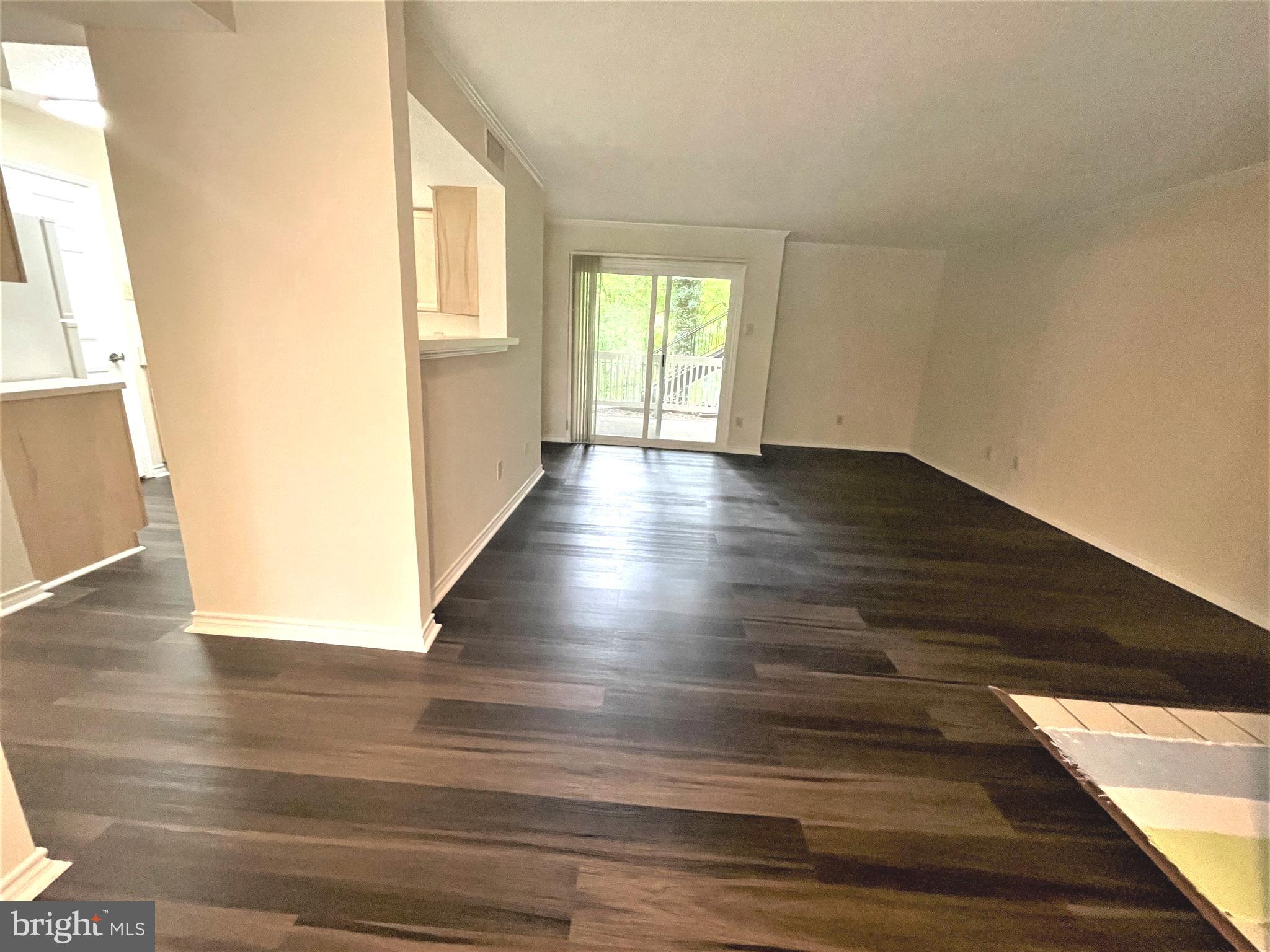 1505 Lincoln Way, Unit 101 McLean, VA 22102 - Photo 4 of 43 Spacious living room with new floor