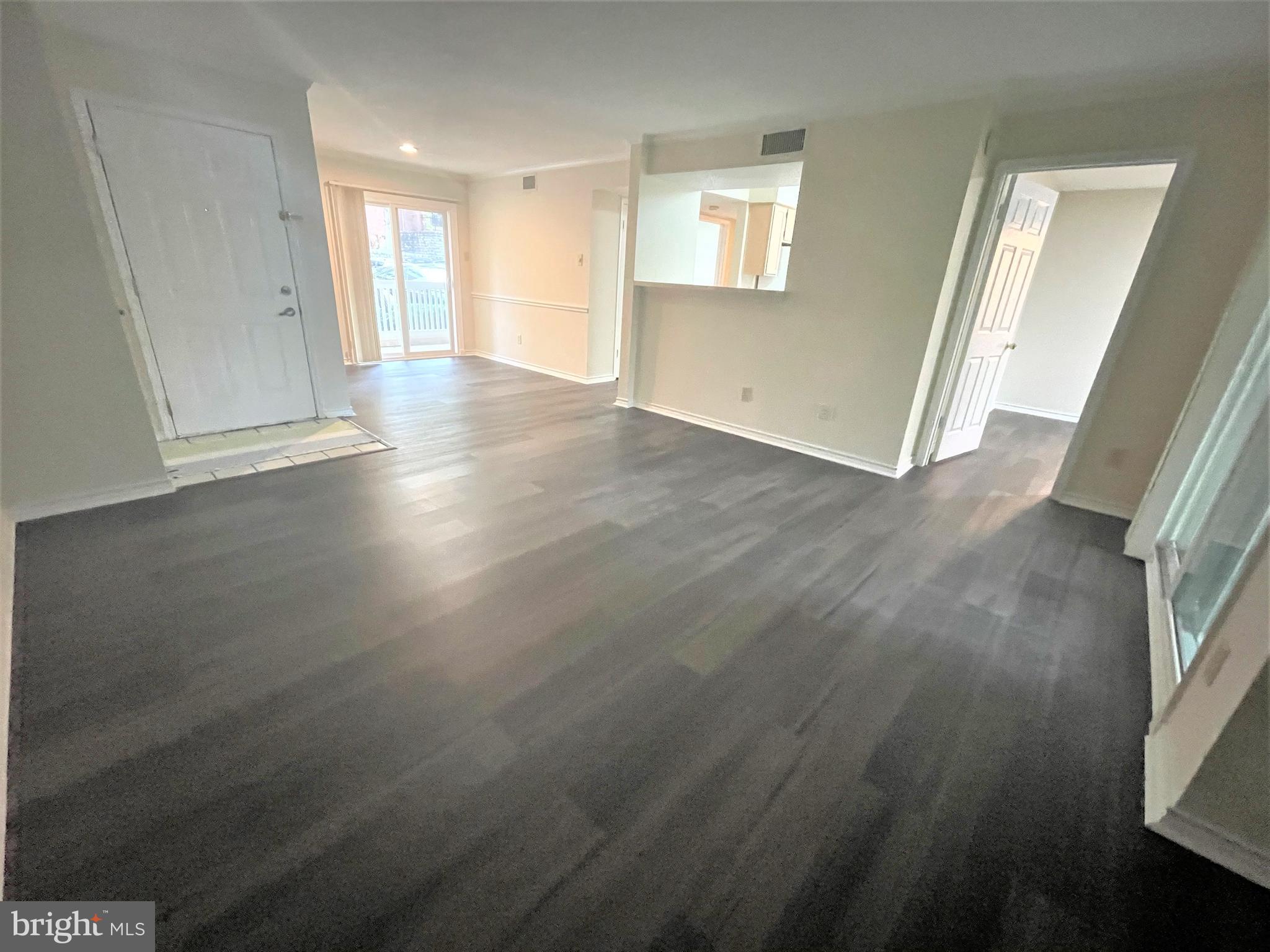 1505 Lincoln Way, Unit 101 McLean, VA 22102 - Photo 5 of 43 Spacious living room with new floor