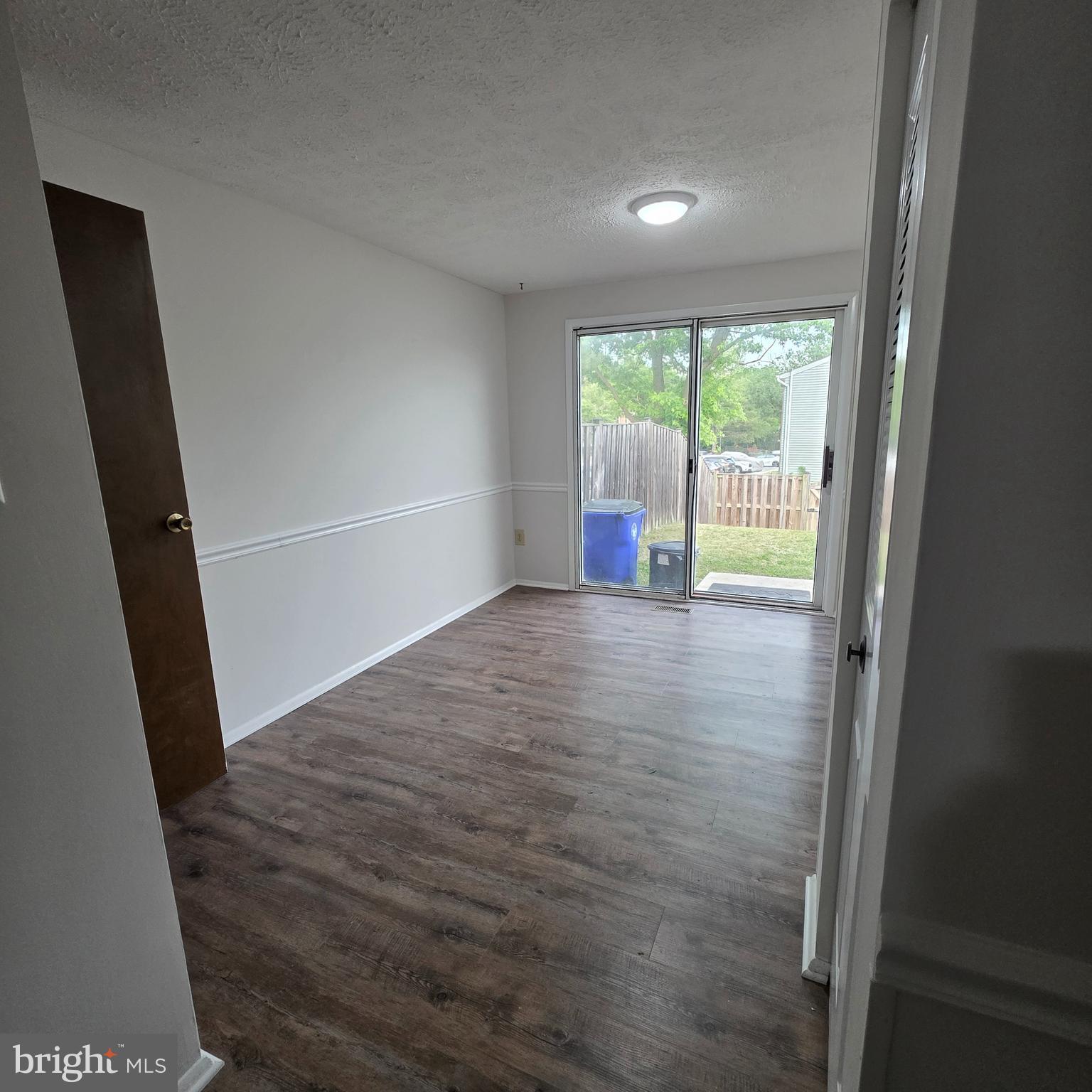 1758 Springfield Lane Frederick, MD 21702 - Photo 6 of 31 wooden floor in an empty room with a window