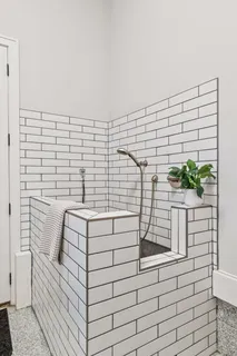 a view of a bedroom with wooden floor and closet