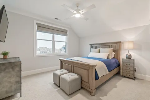 a bathroom with a sink a toilet a shower and a mirror