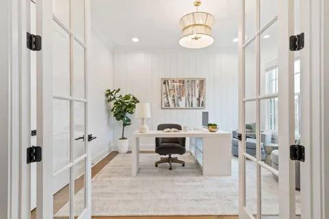 a workspace with furniture and window