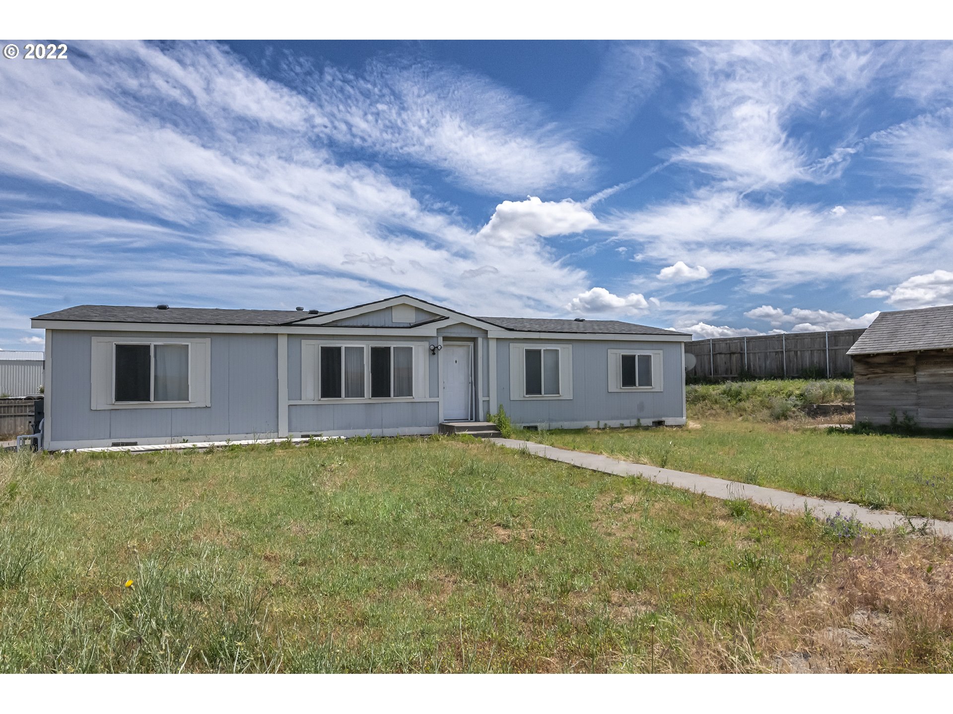 83007 County 643 Road Milton Freewater, OR 97862 - Photo 1 of 22 a front view of a house with a garden