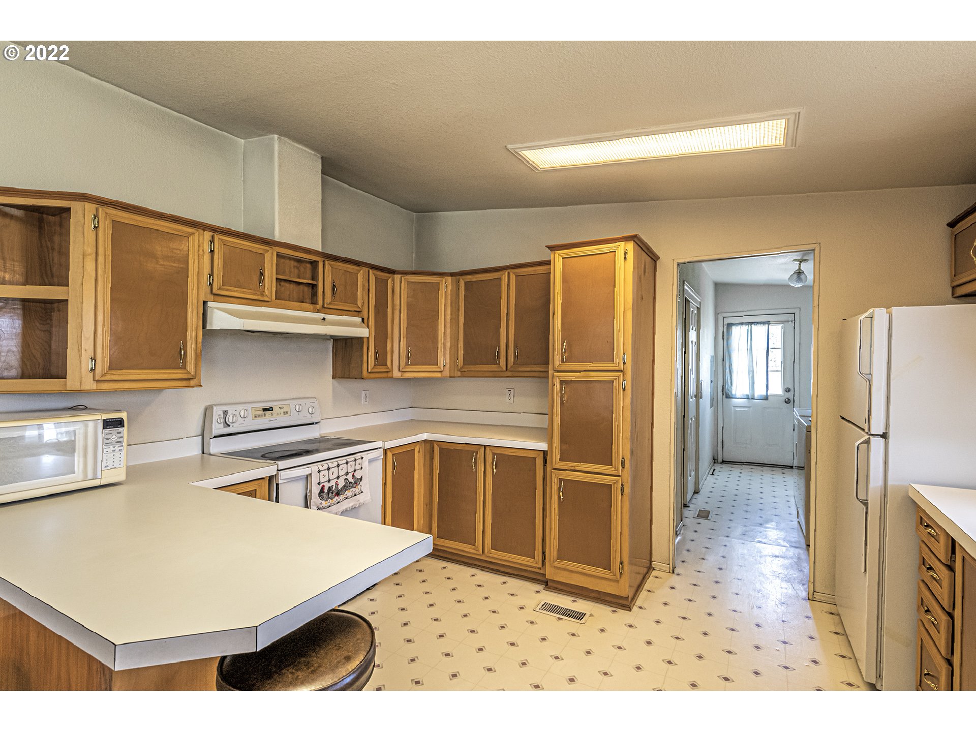83007 County 643 Road Milton Freewater, OR 97862 - Photo 11 of 22 a kitchen with stainless steel appliances a refrigerator and a stove