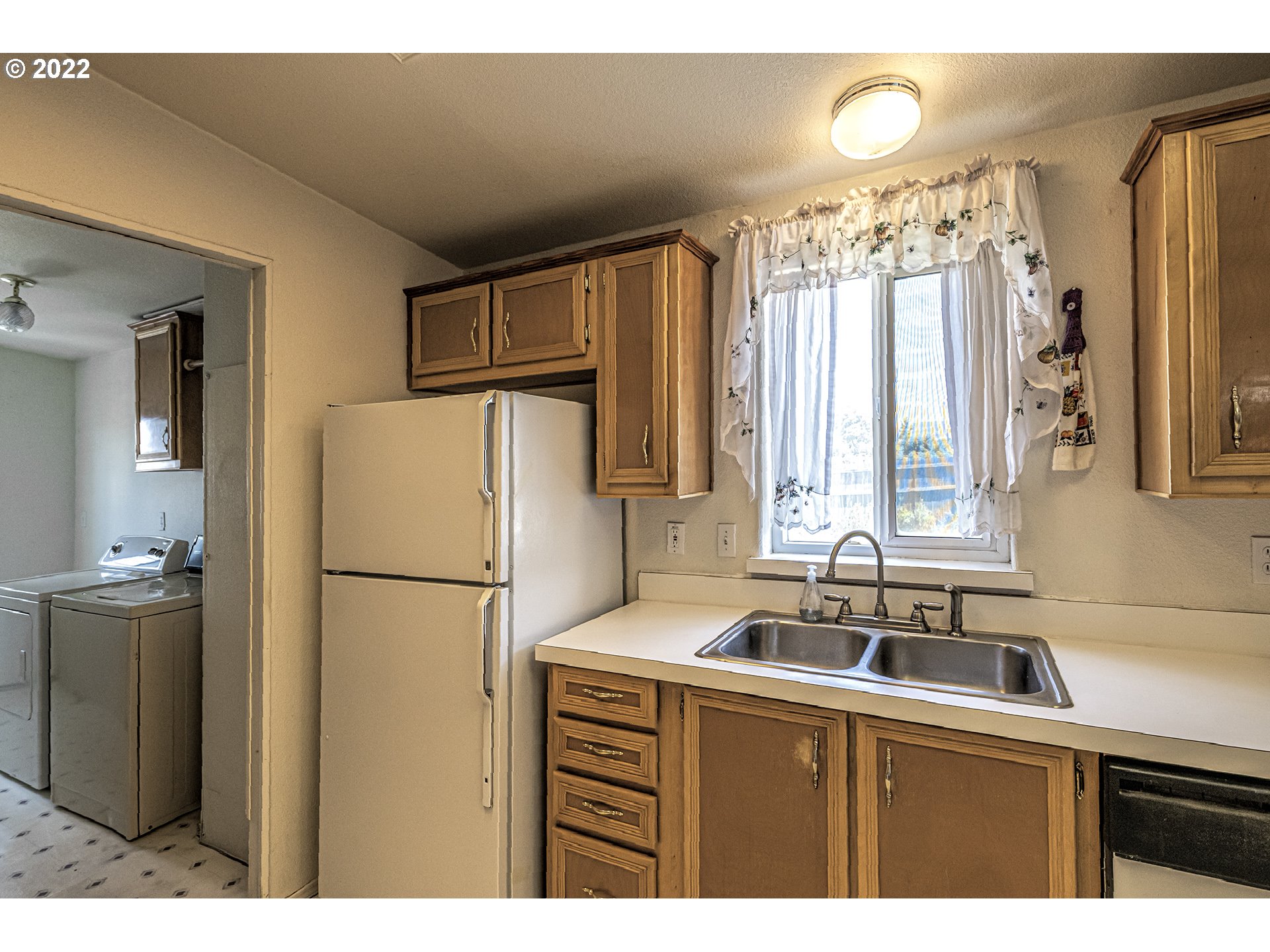 83007 County 643 Road Milton Freewater, OR 97862 - Photo 12 of 22 a kitchen with refrigerator a sink and cabinets
