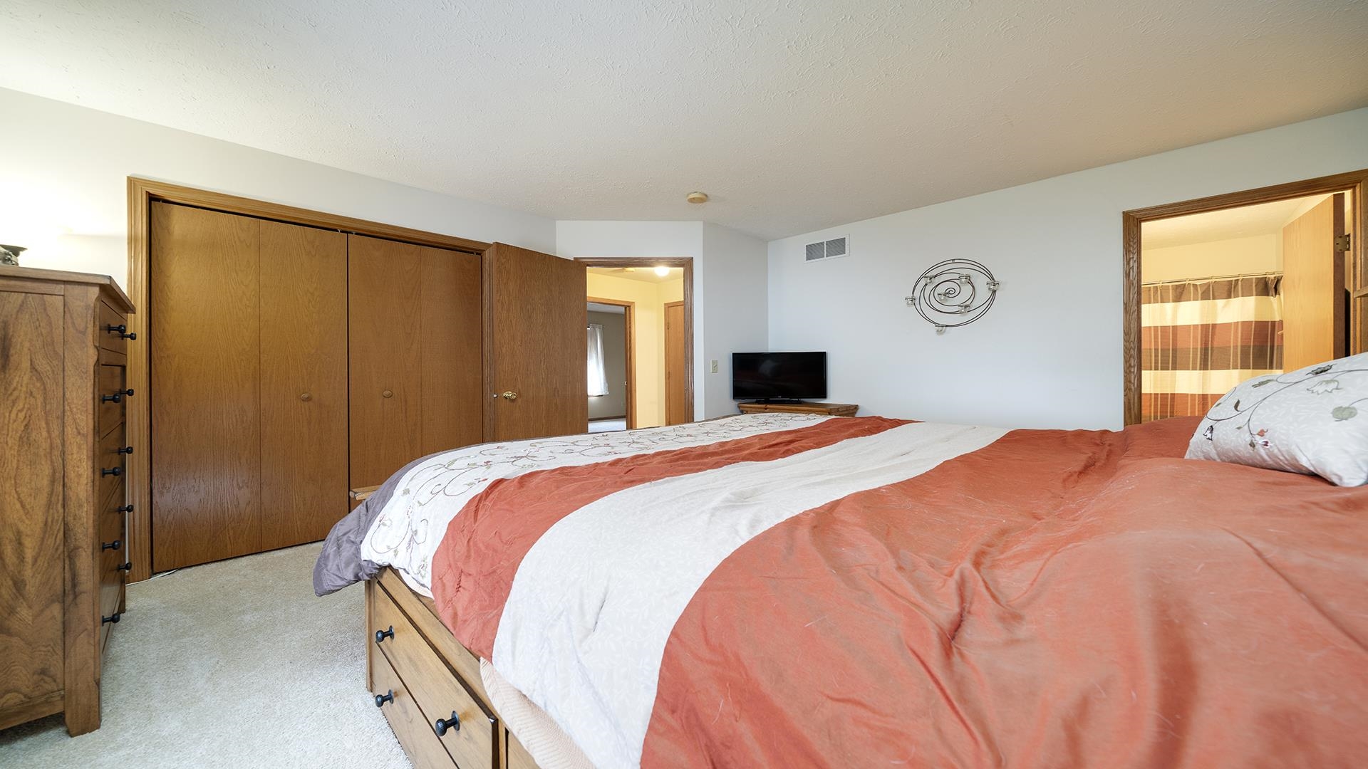 13116 Springhill Drive Winnebago, IL 61088 - Photo 19 of 50 a bed sitting in a bedroom next to a window