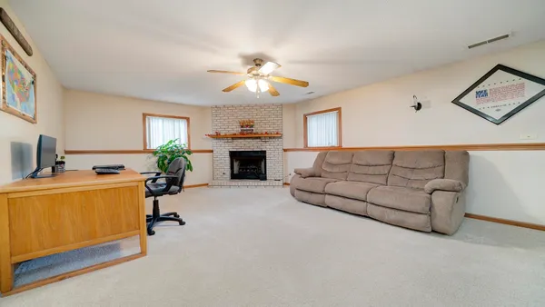 a spacious bedroom with a bed and a cabinets