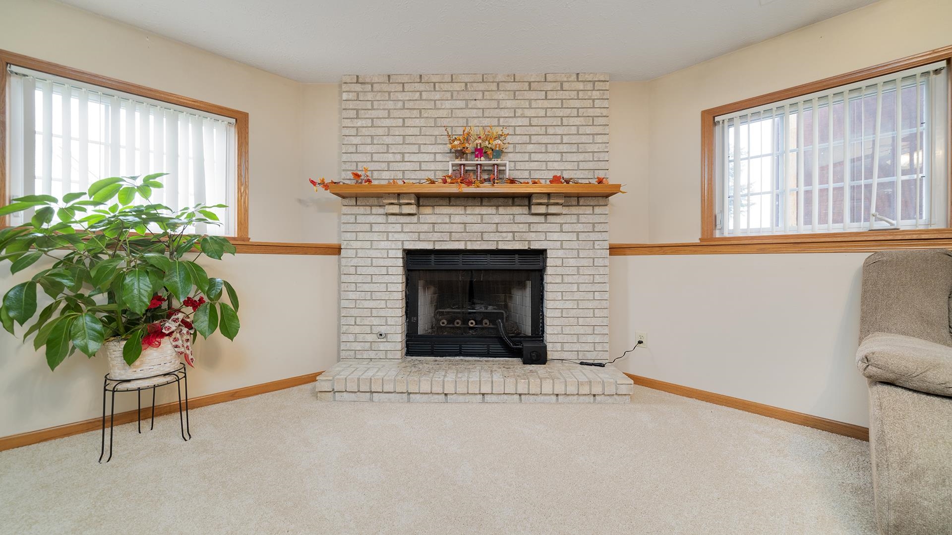 13116 Springhill Drive Winnebago, IL 61088 - Photo 30 of 50 a living room with furniture and a fireplace
