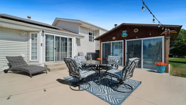 a outdoor dining space with furniture
