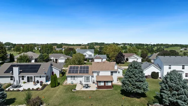 an aerial view of a house with a outdoor space