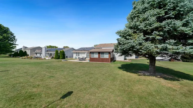 an aerial view of a house with a lake view