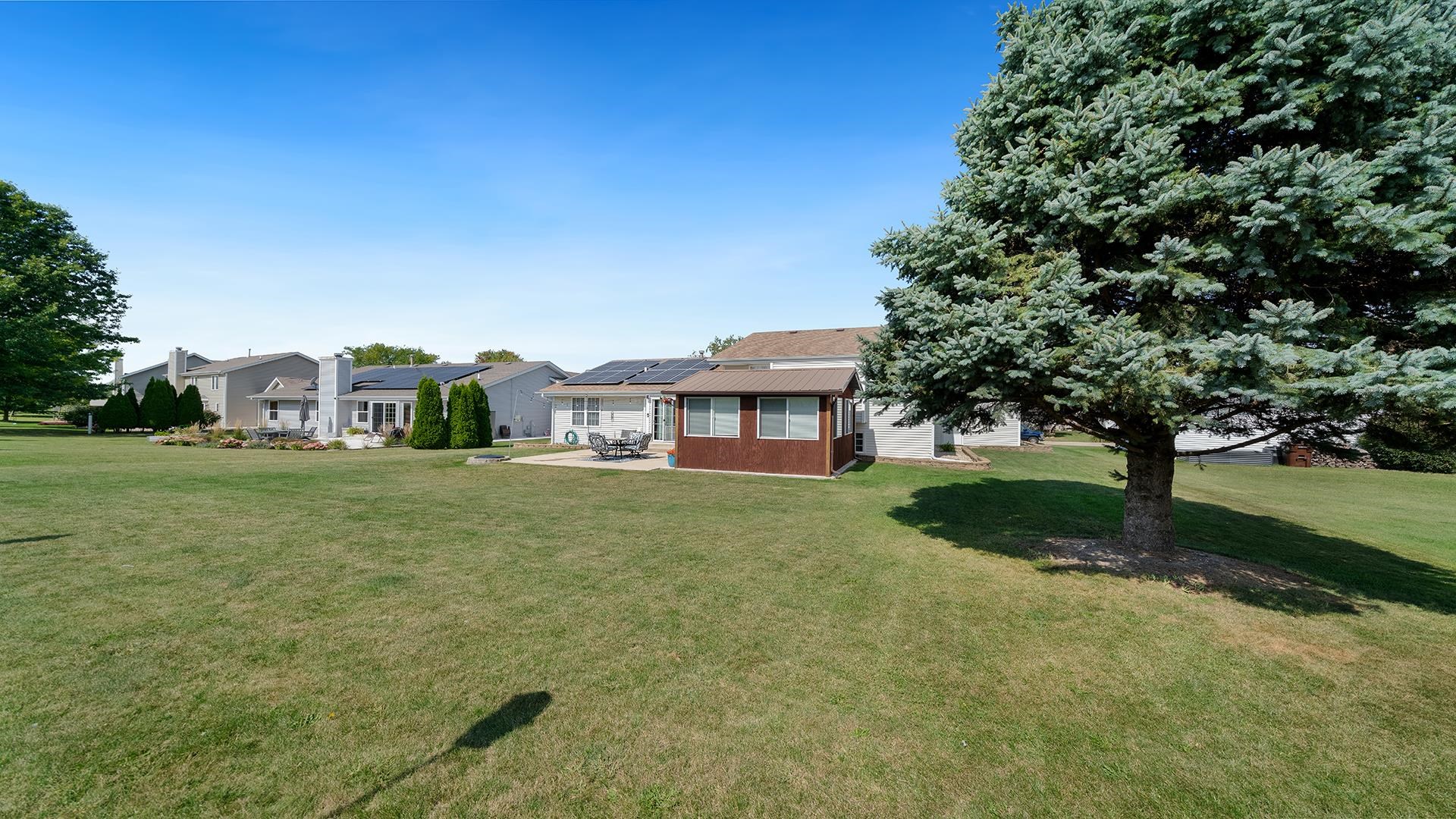 13116 Springhill Drive Winnebago, IL 61088 - Photo 43 of 50 a front view of a house with a yard