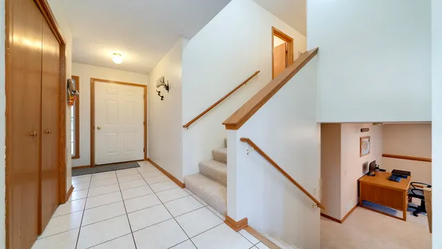 a view of an entryway with stairs