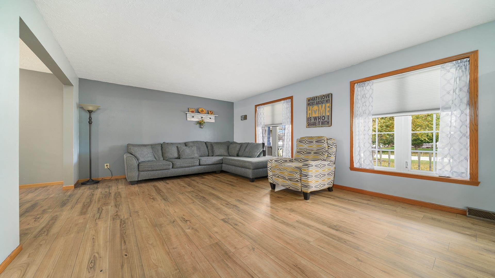 13116 Springhill Drive Winnebago, IL 61088 - Photo 9 of 50 a living room with furniture and a large window