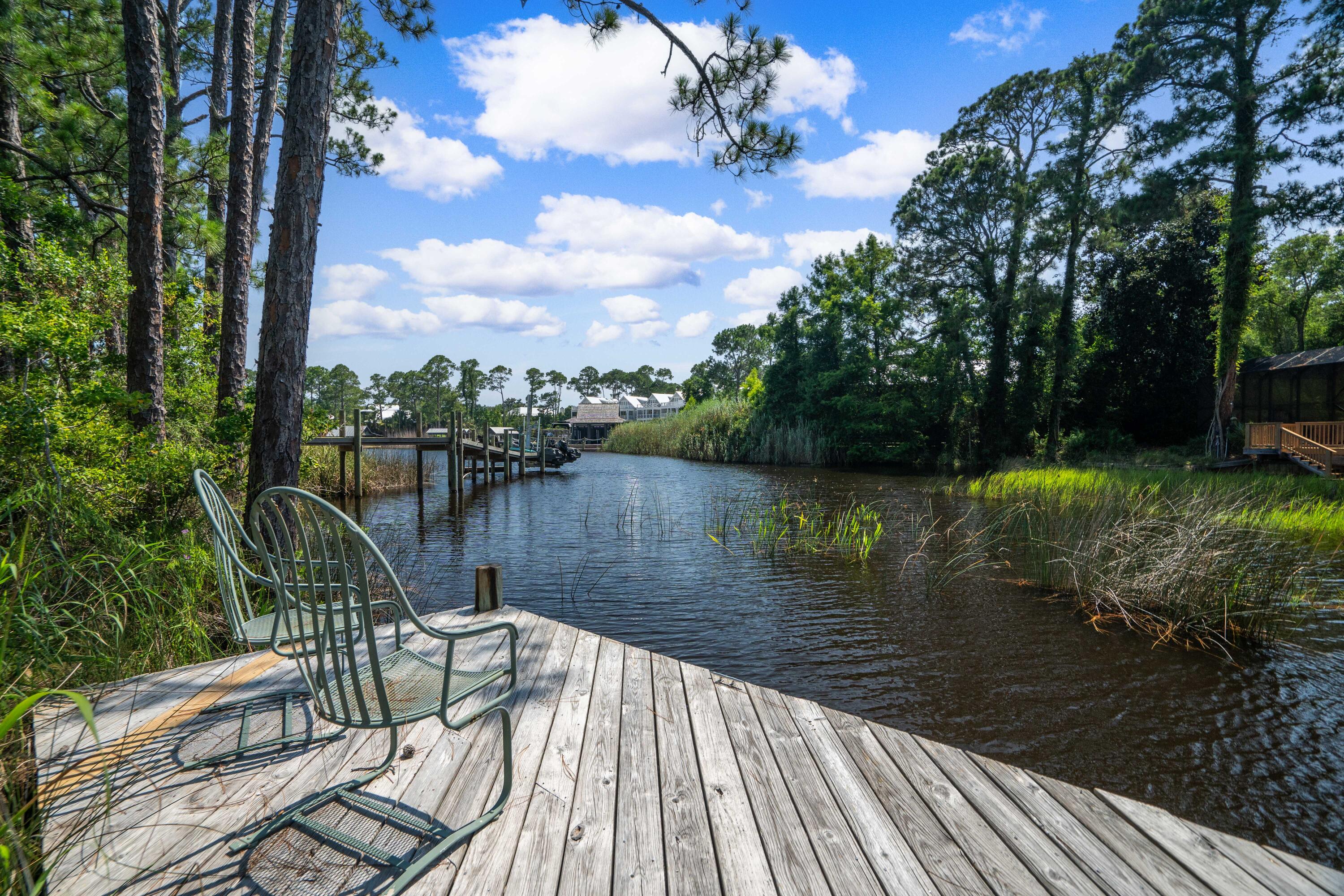 285 Wilderness Way Santa Rosa Beach, FL 32459 - Photo 13 of 69 a lake view with a seating space and lake view