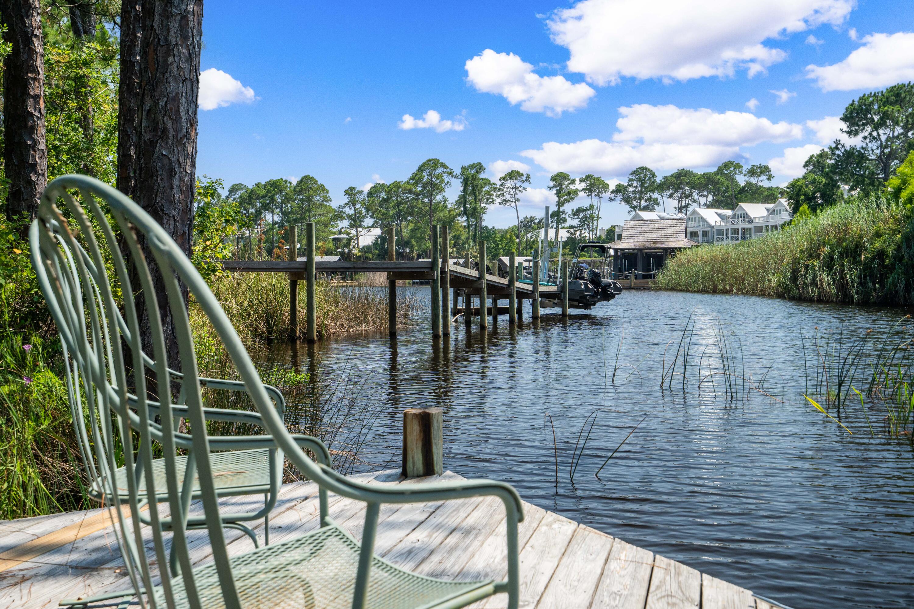 285 Wilderness Way Santa Rosa Beach, FL 32459 - Photo 14 of 69 a view of swimming pool with outdoor seating and plants