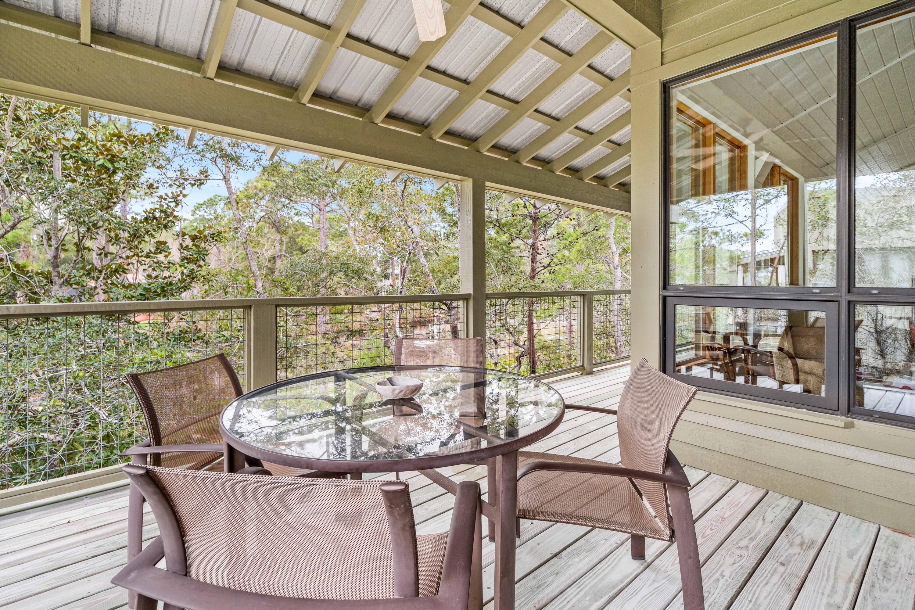 285 Wilderness Way Santa Rosa Beach, FL 32459 - Photo 38 of 69 a view of a dining room with furniture window and outside view