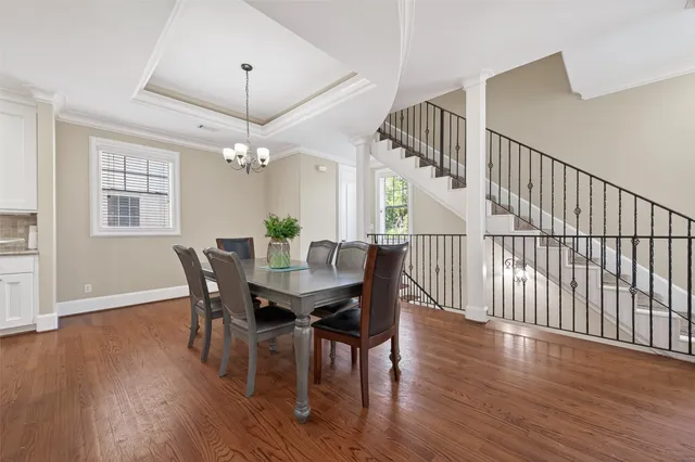 a kitchen with stainless steel appliances granite countertop a sink and wooden cabinets