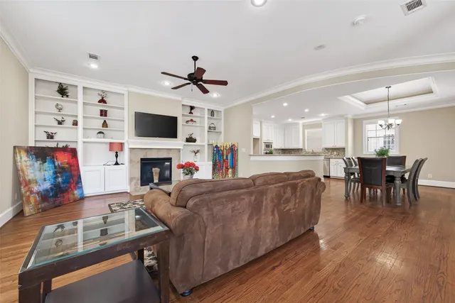 a bedroom with a bed and a ceiling fan