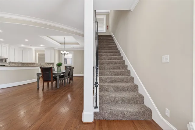 a bedroom with a bed tv and a window